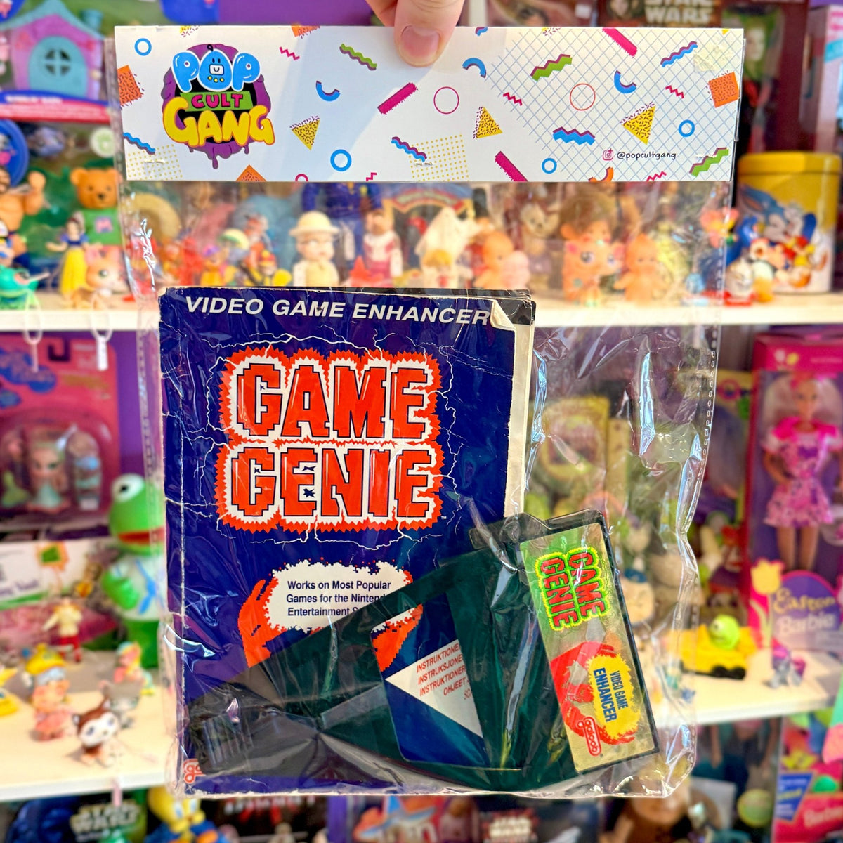 Nintendo NES: Game Genie + Book (80s) - PopCultGang