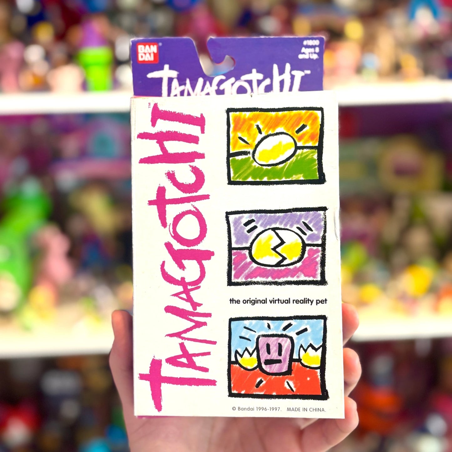 Tamagotchi Gen 1 - Pink Shell with Green and Blue Details (1997, Bandai) - PopCultGang