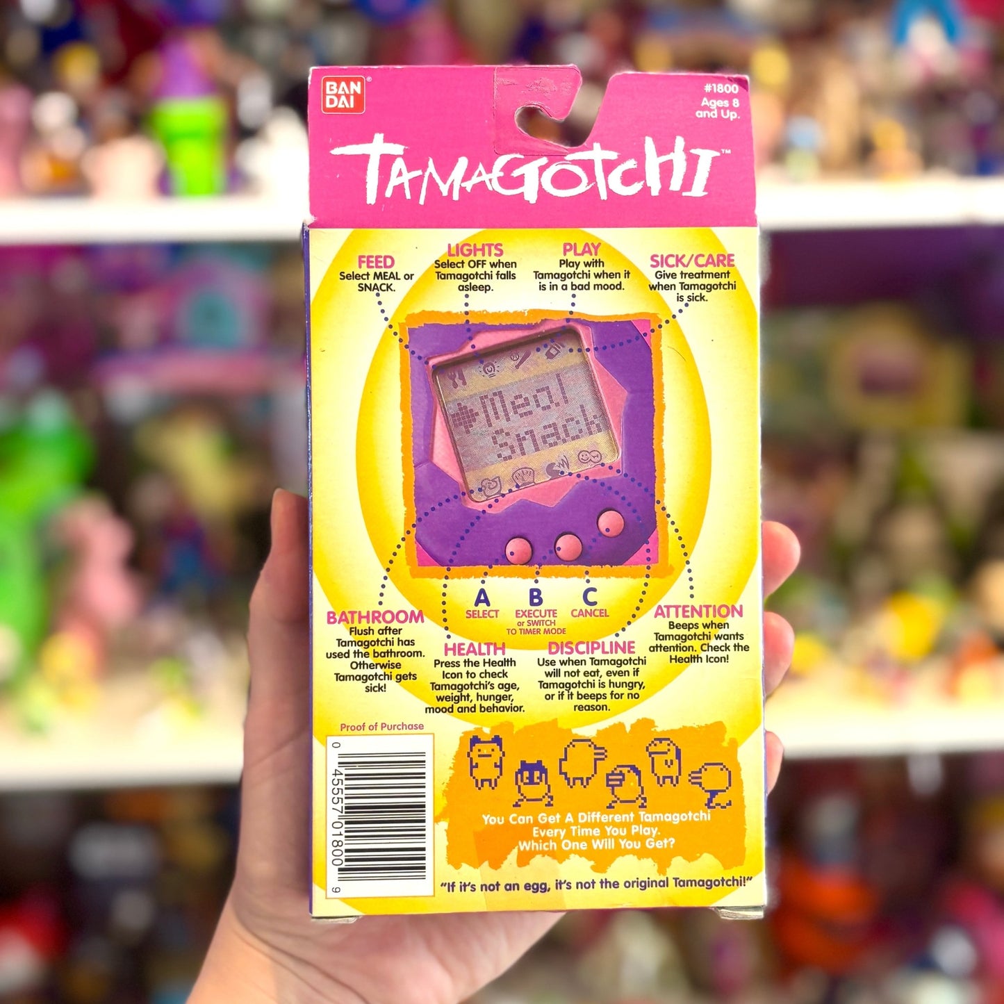 Tamagotchi Gen 1 - Pink Shell with Green and Blue Details (1997, Bandai) - PopCultGang