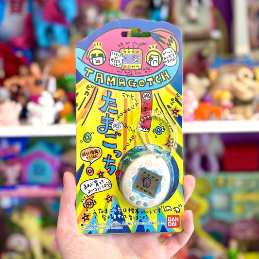 Tamagotchi Gen 1 - White Shell with Twirls Japanese (1997, Bandai) - PopCultGang